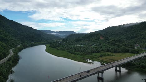 Aerial-drone-view-of-stunning-highway-over-river-in-Bato-town,-Catanduanes-islands