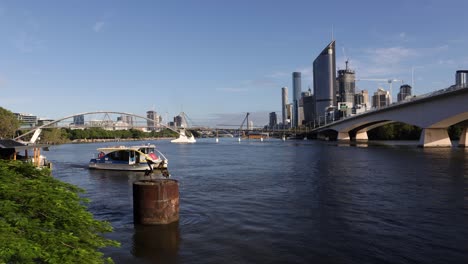 View-of-a-ferry-and-Brisbane-City-on-a-sunny-day-in-the-morning