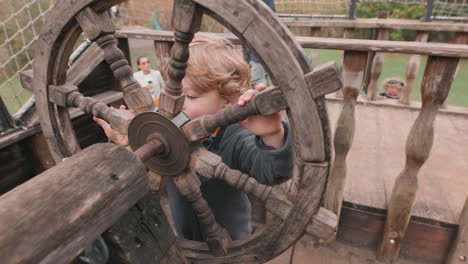 child-playing-with-a-ship-wheel---imagination-playing-make-believe