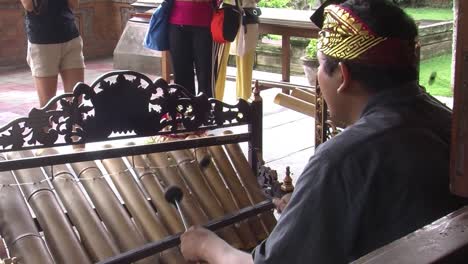 Musician-playing-Rindik,-traditional-musical-instrument-from-Bali