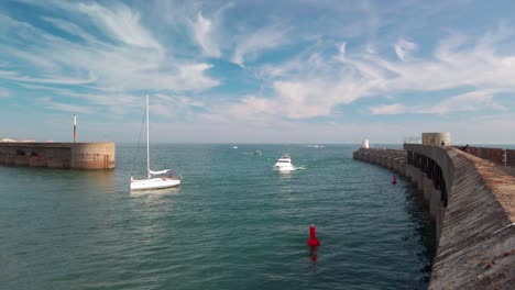 Boats-entering-and-exiting-Brighton-Marina-harbour-UK