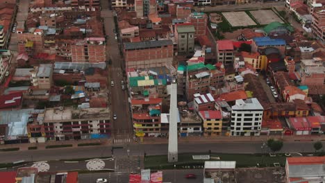 4k-daytime-hyperlapse-aerial-drone-footage-with-Condor-Apuchin-monument-from-San-Sebastian-district-in-Cusco,-Peru-during-Coronavirus-Lockdown