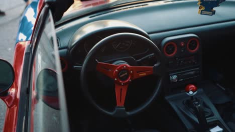 Overhead-Shot-Into-Cockpit-of-a-Pokemon-Themed-Convertible-Mazda-Miata