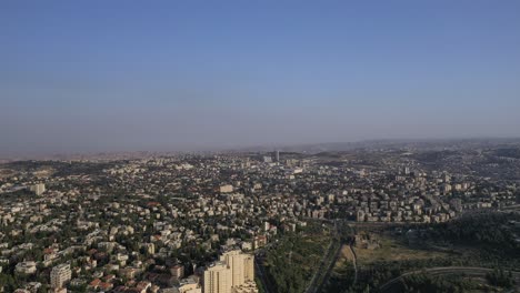 Aerial-far-long-shot-of-Jerusalem-city-urban-area-from-the-sky,-clear-day