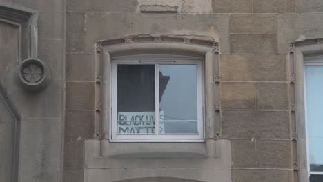 Close-up-of-a-Black-Live-Matter-sign-above-the-main-door-in-the-city-centre