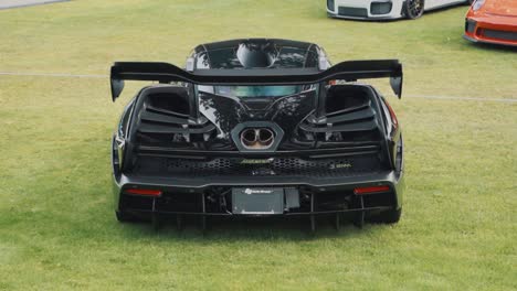 Punch-In-Shot-of-the-Rear-End-of-a-Mclaren-Senna-on-Grass-at-Car-Show