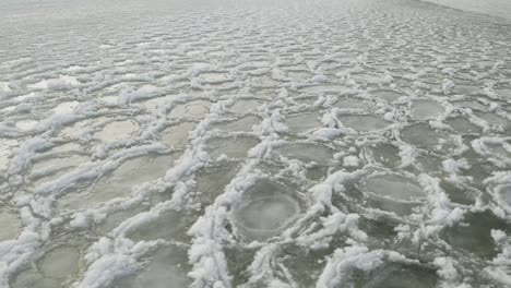 Rotating-aerial-frozen-lake-surface-ice-sheets-4K