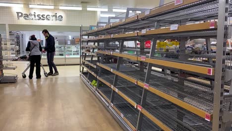 Empty-shelves-with-no-customers-around-in-the-bread-section-of-the-supermarket-Sainsbury's-in-London-during-the-Coronavirus-pandemic