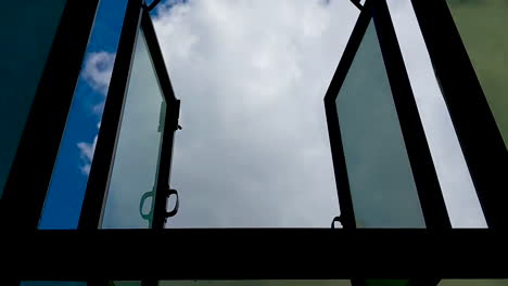 Time-lapse-beautiful-blue-sky-with-clouds-framed-through-the-window
