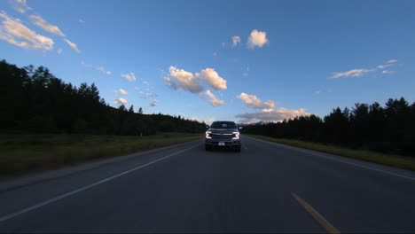 A-Drone-Shot-Of-Ford's-New-2020-F150-Pickup-Truck-Seen-Driving-Down-Road-During-Sunset