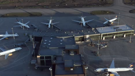 Aerial-over-closed-airport-terminal-with-inactive-airplanes-by-global-pandemic