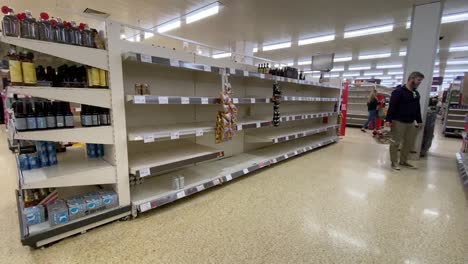 Empty-shelves-in-the-alcohol-section-of-the-supermarket-Sainsbury's-in-London-during-the-Coronavirus-pandemic