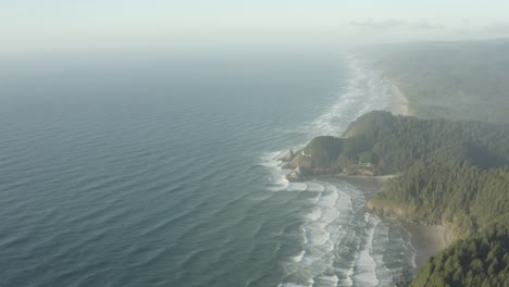 Wide-high-altitude-aerial-of-Oregon-coast-and-Haceta-Head-lighthouse