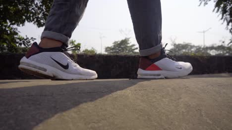 man-wareing-nike-shoe-jumping-from-pipe-to-pipe-in-style-cargo-paints-slow-motion