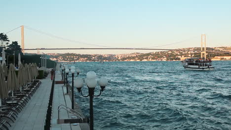 Cityscape-of-Bosphorus-with-Marmara-Sea-and-Iconic-Bridge-of-Istanbul-City-between-Asia-and-Europe-Continents-while-Boats-are-Passing-by