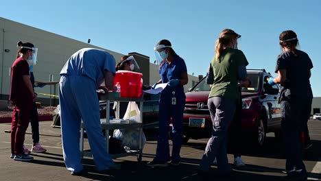 Volunteer-medical-staff-working-at-Covid-19-vaccine-distribution-site