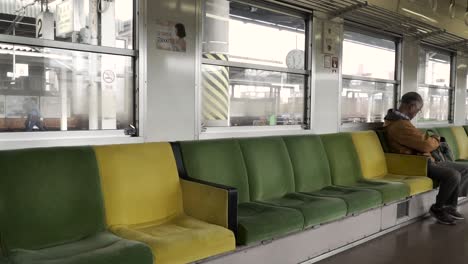 Seat-level-right-pan-inside-half-empty-local-Japanese-train