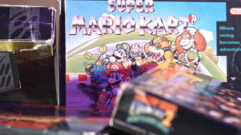 Vintage-Super-Mario-Kart-Box-with-Other-Games-Surrounding-in-Purple-Light-SLIDE-RIGHT