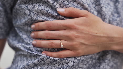 Close-up-of-a-beautiful-engagement-ring-on-a-young-woman's-finger