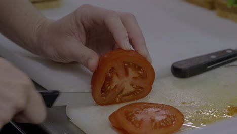 Slicing-fresh-tomato-for-food-preparation