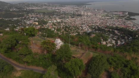 Aeriel-overhead-drone-view-of-a-fort-with-restored-canons-and-the-city-of-Port-of-Spain-in-the-background