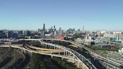 Aerial-view-of-Brisbane-city-and-CBD-Skyine-from-one-of-the-main-highway,-road-at-sunrise-on-a-beautiful-winter-morning-sunrise