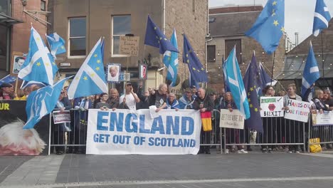 Slow-motion-of-Scottish-protesters-and-their-flags-outside-the-Perth-Concert-Hall-where-the-Tory-Leadership-Hustings-is-being-held