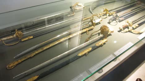 Sword-exhibitor-at-the-Army-Museum,-Paris,-France