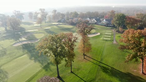 Cinematic-aerial-establishing-shot-of-Lancaster-Country-Club,-William-Flynn-golf-course-in-autumn