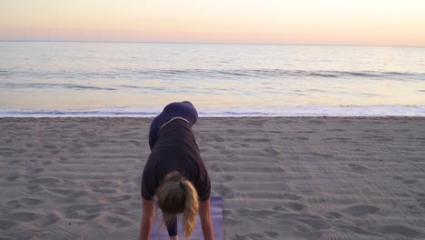 Doing-yoga-on-a-quiet-beach-while-the-sun-is-setting-in-the-background