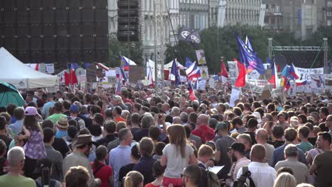 People-at-demonstration-holding-czech-and-european-flags