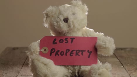 Teddy-bear-with-red-label-displaying-lost-property