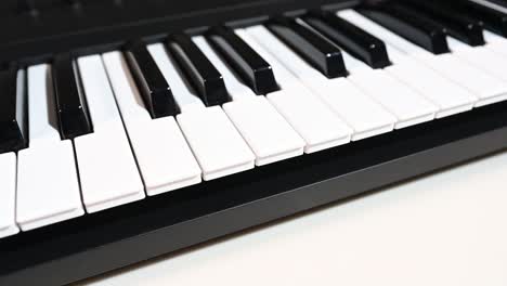 Just-keys-on-a-keyboard,-keyboard-sitting-at-an-angle,-super-smooth-rail-shot