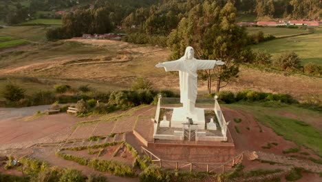 4K-daytime-before-sunset-aerial-down-view-over-the-statue-of-Cristo-Blanco-located-on-the-northern-hills-of,-capital-of-the-Inca-in-Peru