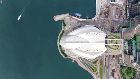 Hong-Kong-famous-Convention-and-Exhibition-Centre-building-in-Victoria-harbour,-Top-down-aerial-view