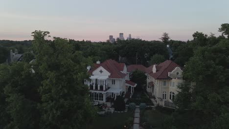 houses-in-the-suburbs-during-summer-time-with-downtown-minneapolis-view-in-the-background