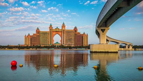 Stunning-Timelapse-Video-of-Atlantis-Hotel-and-The-Pointe-Palm-Jumeirah-after-Sunrise,-with-moving-clouds-and-water