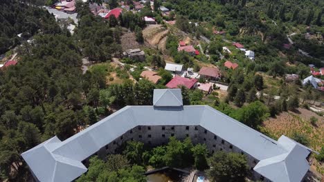 Wide-aerial-view-of-the-back-of-the-famous-Veregaria-Hotel-in-Prodromos,-Cyprus-Island-in-Greece-on-June-19,-2020