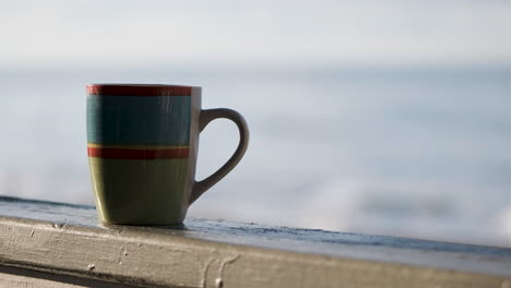 Coffee-cup-behind-Emerald-Isle,Nc-shoreline