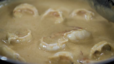 Fresh-Prawns-turn-Red-while-cooking-in-Coconut-Cream-Curry---Close-Up