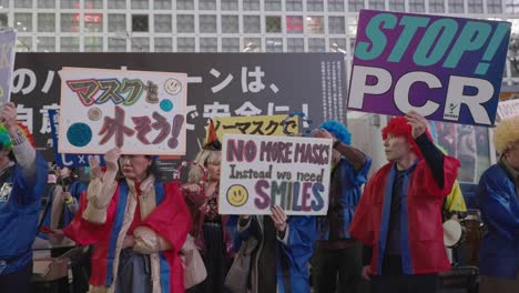 People-Wearing-Costumes-With-Placards-Protesting-Against-Wearing-Masks-Lockdown-And-PCR-Test-In-Shibuya-On-Halloween-Night-In-Tokyo,-Japan