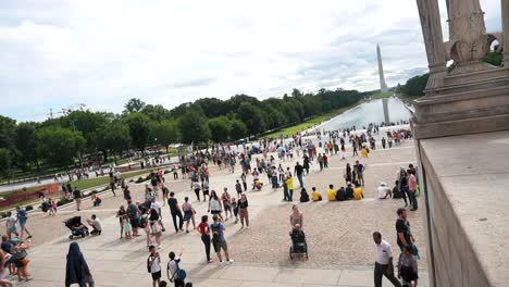 People-At-Lincoln-Memorial-Park-With-Memorial-Reflecting-Pool-And-Washington-Monument-At-Background-In-Washington-DC,-United-States