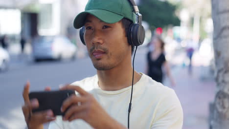 a-young-man-listening-to-music-while-out