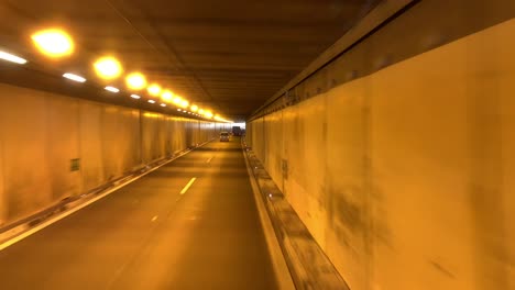 Point-of-view-footage-while-driving-from-Switzerland-to-Germany-through-a-tunnel