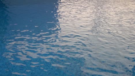 The-water-swirling-on-the-surface-of-a-swimming-pool