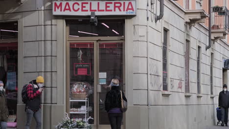 People-Waiting-In-Queue-Outside-A-Butcher-Shop-In-Milan,-Italy