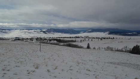lawn-covered-with-white-snow-in-a-winter-wonderland-landscape-in-the-Nicola-Valley-Canada-on-a-cloudy-day