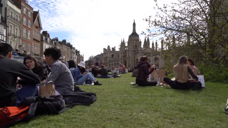 People-relax-on-the-grass-in-front-of-Kings-College-on-a-sunny-day