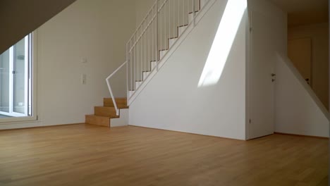 Big,-sunny-living-room-with-a-staircase
