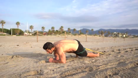 shirtless-guy-doing-crawling-exercise-on-elbows-in-the-morning